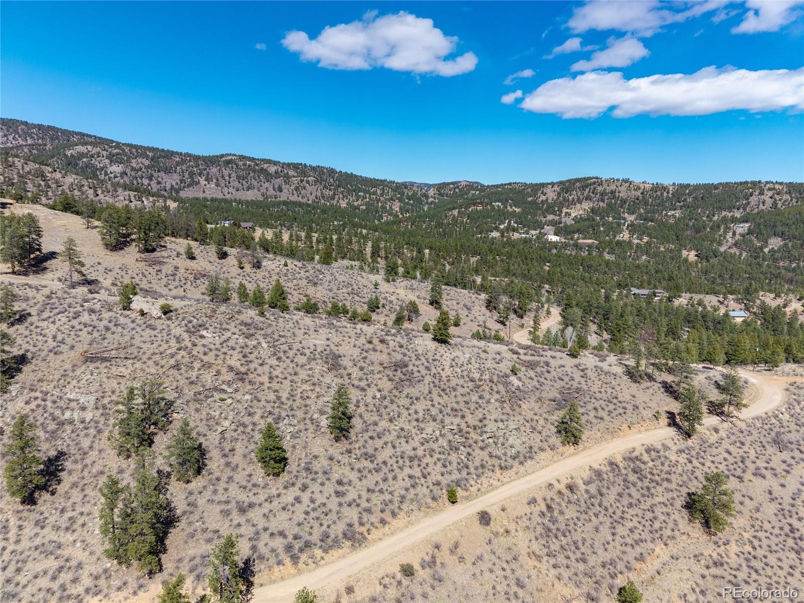 12 A Bailey Estates Bailey, CO 80421 - Photo 7 of 36 a view of a lake with mountains in the background