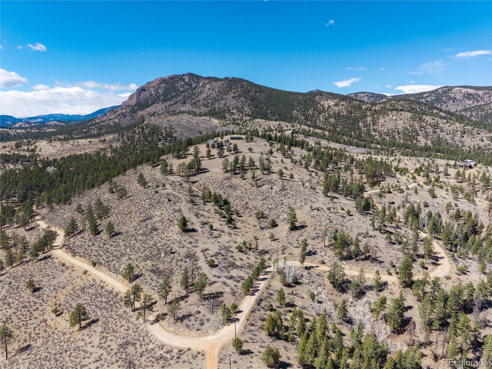 12 A Bailey Estates Bailey, CO 80421 - Photo 9 of 36 a view of a dry yard with mountains in the background
