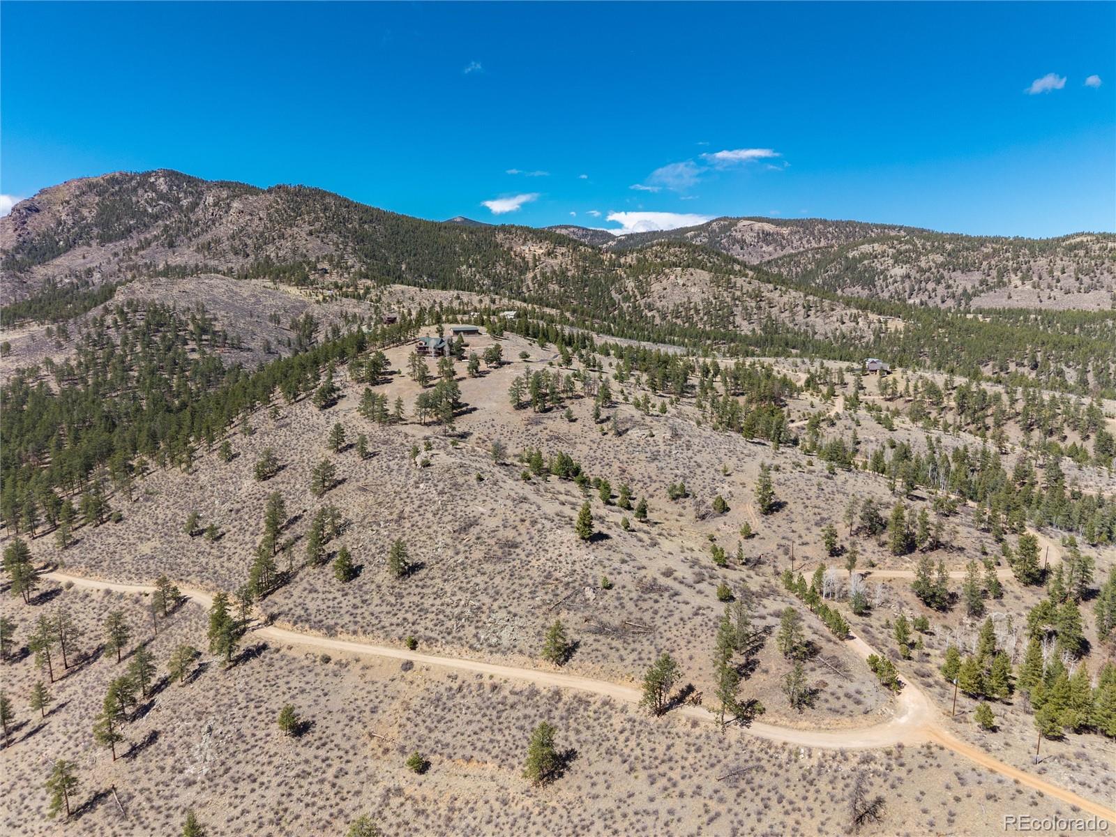 12 A Bailey Estates Bailey, CO 80421 - Photo 10 of 36 a view of a yard with a mountain