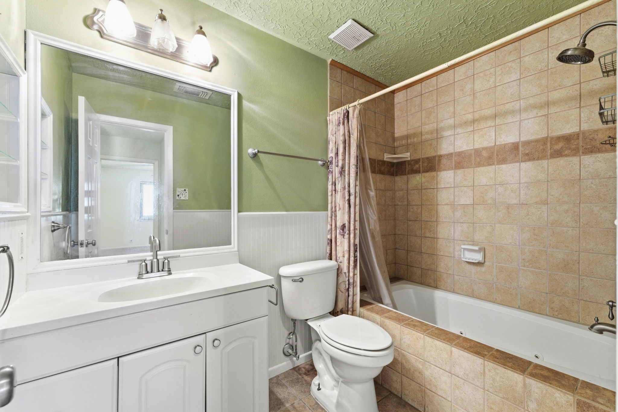 21514 Slippery Creek Lane Spring, TX 77388 - Photo 18 of 27 a bathroom with a sink a toilet and shower