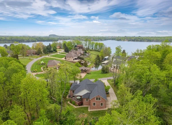 an aerial view of a house with garden space and outdoor seating