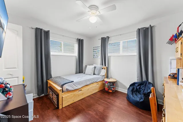 a bedroom with bed and a window