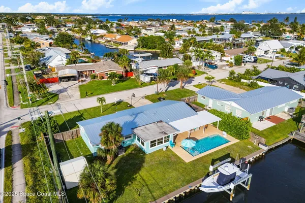 an aerial view of residential houses with outdoor space