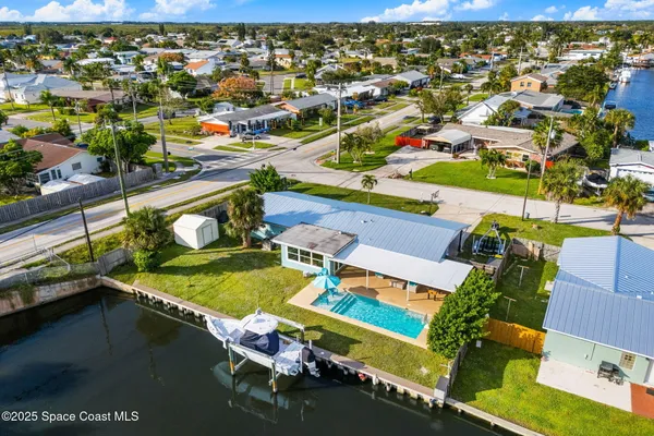 an aerial view of a swimming pool patio swimming pool and outdoor seating