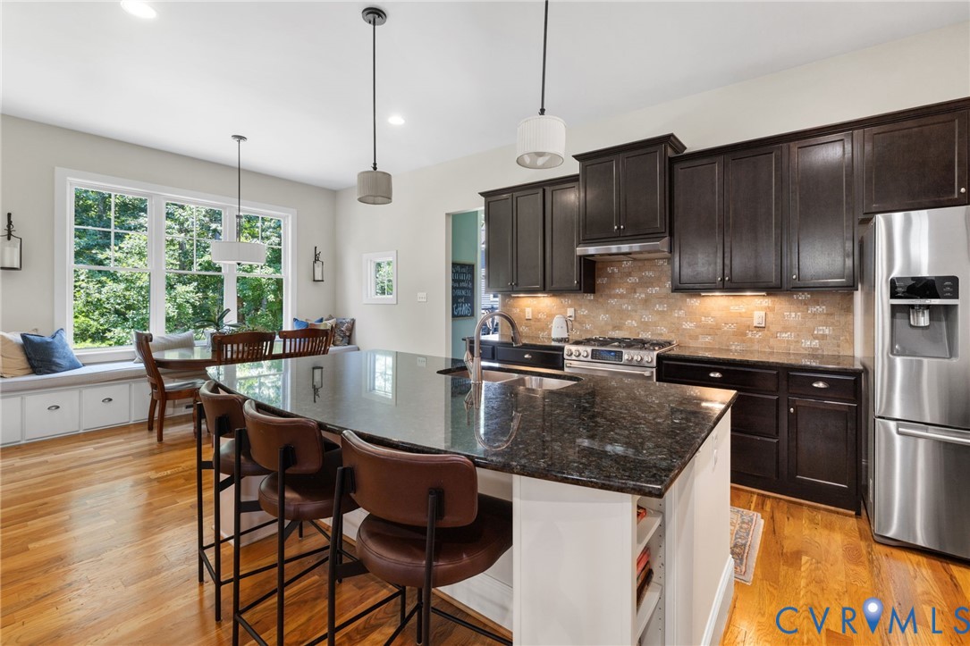 15936 Alsdell Road Midlothian, VA 23112 - Photo 12 of 45 Gourmet kitchen featuring a large island with dark