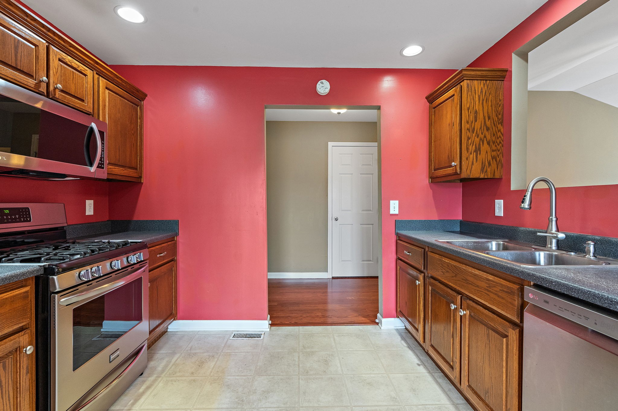602 Windy Road Mount Juliet, TN 37122 - Photo 8 of 27 a kitchen with stainless steel appliances granite countertop a stove a sink and a microwave