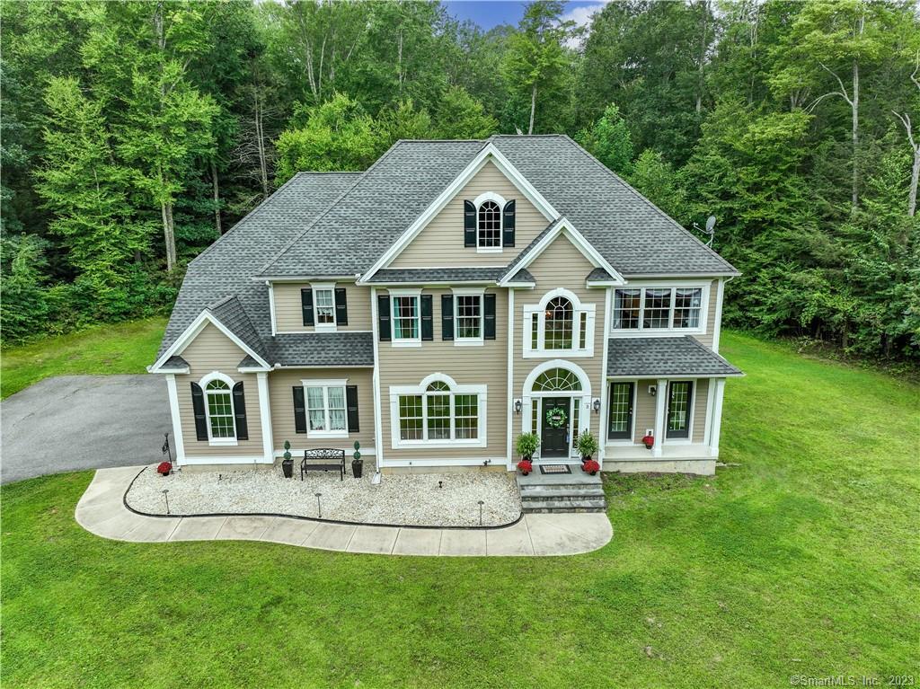 3 Clemons Spring Road North Granby, CT 06060 - Photo 1 of 1 a front view of a house with a yard