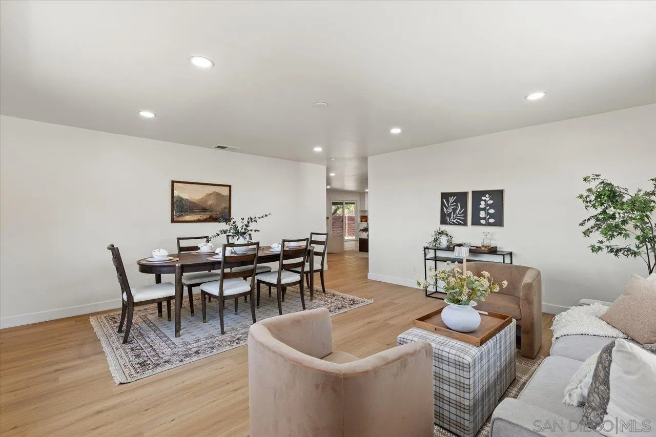 30118 Miller Road Valley Center, CA 92082 - Photo 12 of 75 a living room with furniture and a dining table with wooden floor