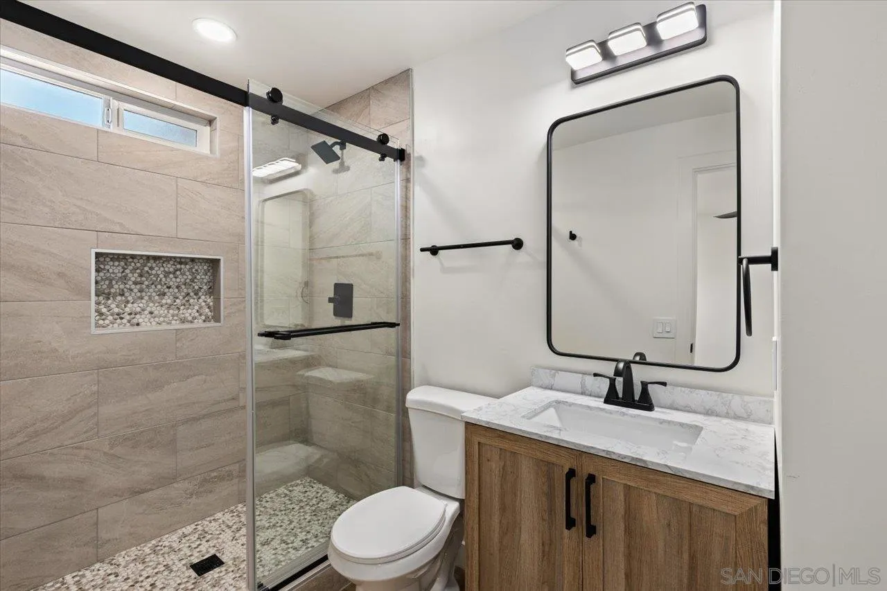 30118 Miller Road Valley Center, CA 92082 - Photo 23 of 75 a bathroom with a sink a toilet and shower