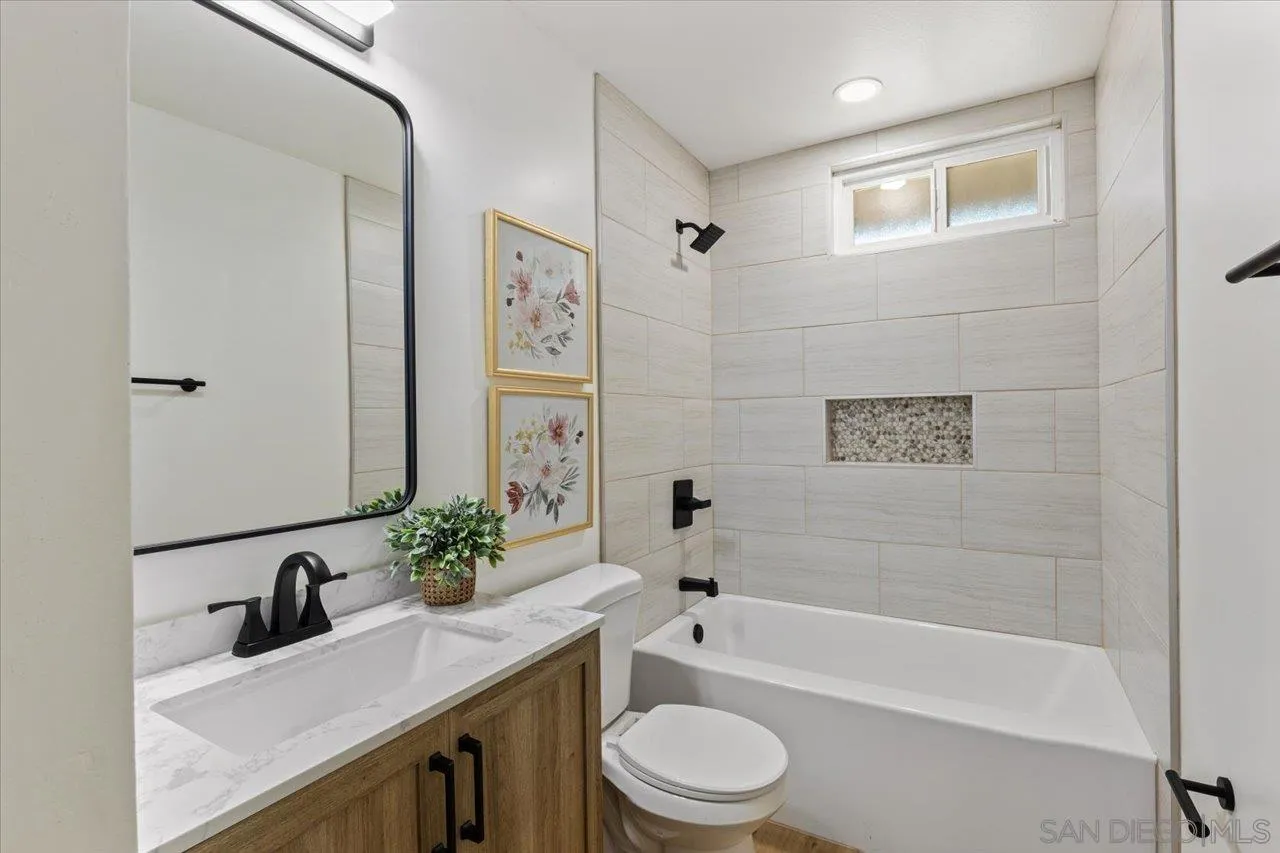 30118 Miller Road Valley Center, CA 92082 - Photo 27 of 75 a bathroom with a granite countertop sink a toilet and bathtub