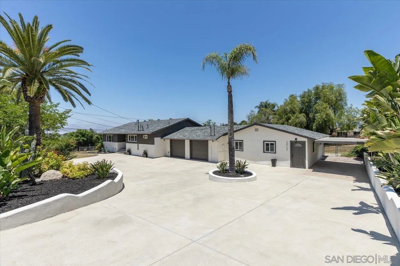 30118 Miller Road Valley Center, CA 92082 - Photo 63 of 75 a front view of a house with a garden and a yard
