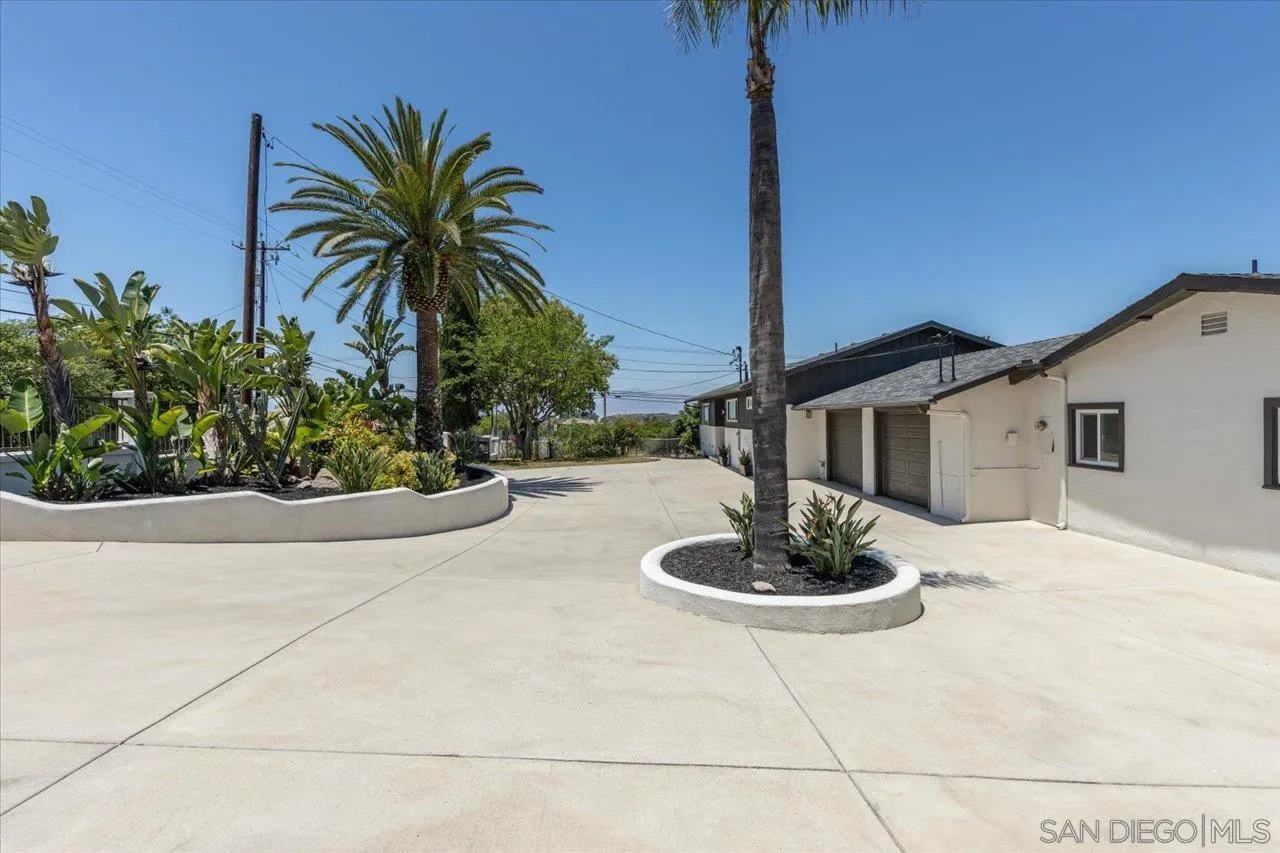 30118 Miller Road Valley Center, CA 92082 - Photo 75 of 75 a white house with a yard and plants