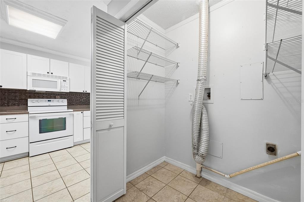6878 Southwest 36th Street Lake Butler, FL 32054 - Photo 16 of 30 a kitchen with a stove and a refrigerator