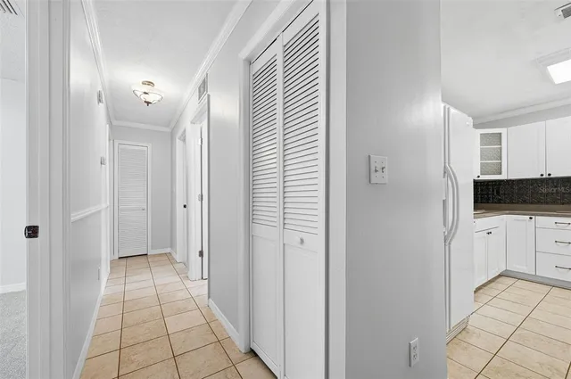 a view of a hallway to a bedroom and a bathroom