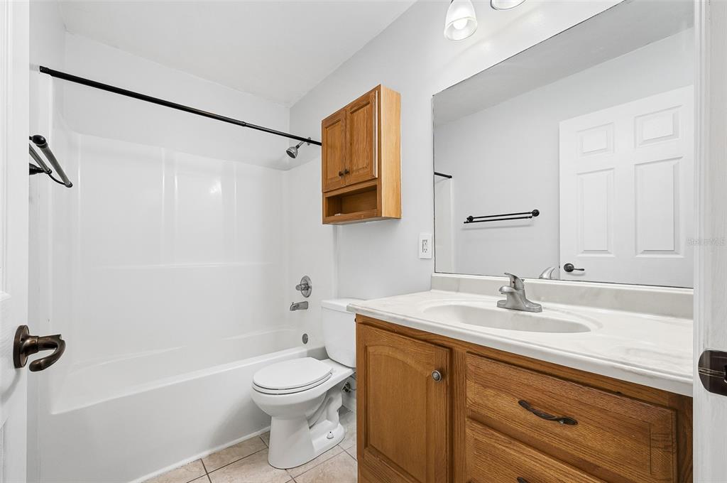 6878 Southwest 36th Street Lake Butler, FL 32054 - Photo 23 of 30 a bathroom with a sink a toilet and shower