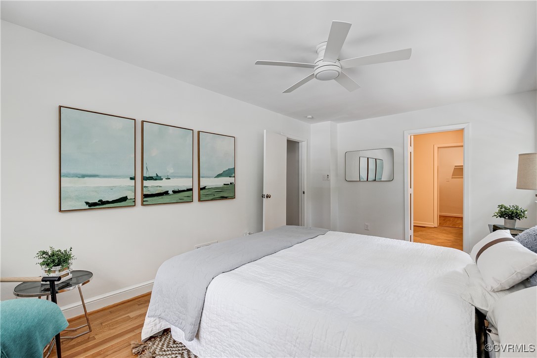 7654 Cherokee Road Richmond, VA 23225 - Photo 19 of 35 a bedroom with a bed mirror and window
