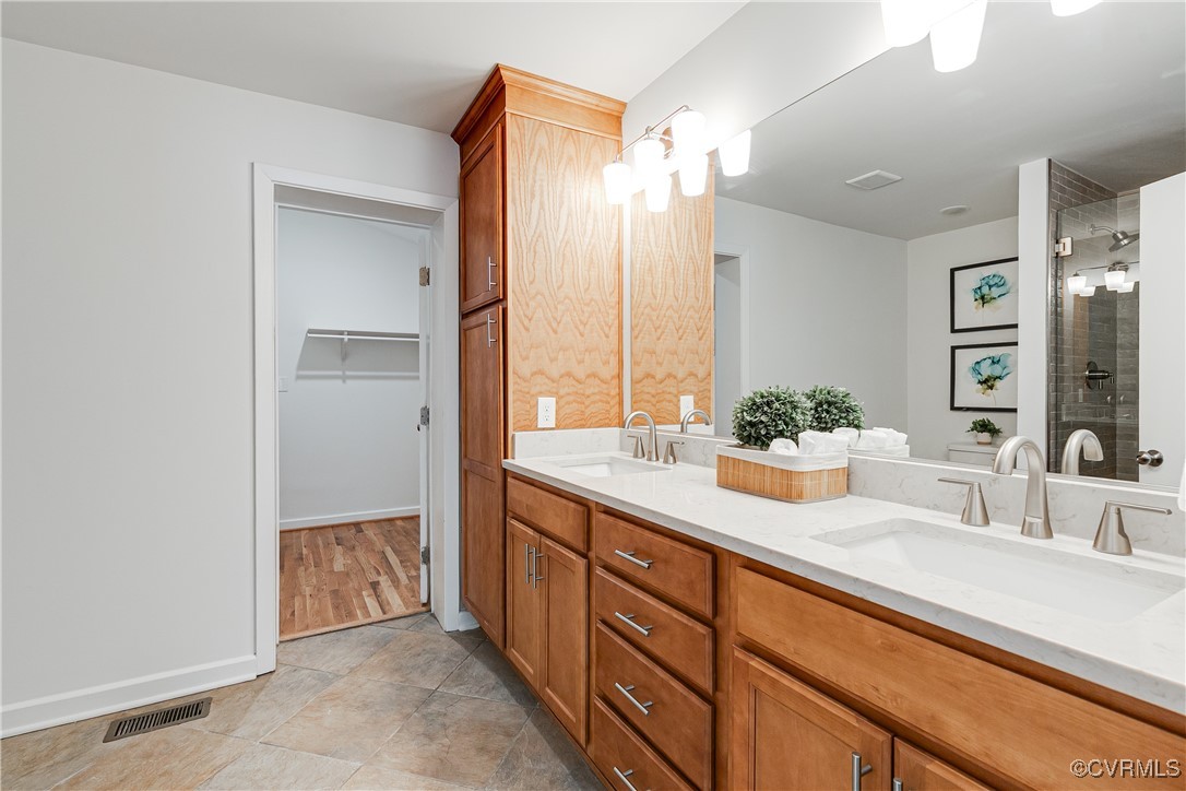 7654 Cherokee Road Richmond, VA 23225 - Photo 20 of 35 a bathroom with a sink and a mirror