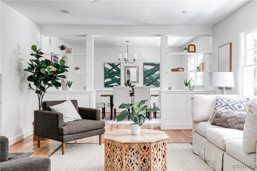 7654 Cherokee Road Richmond, VA 23225 - Photo 2 of 35 a living room with furniture potted plant and a mirror