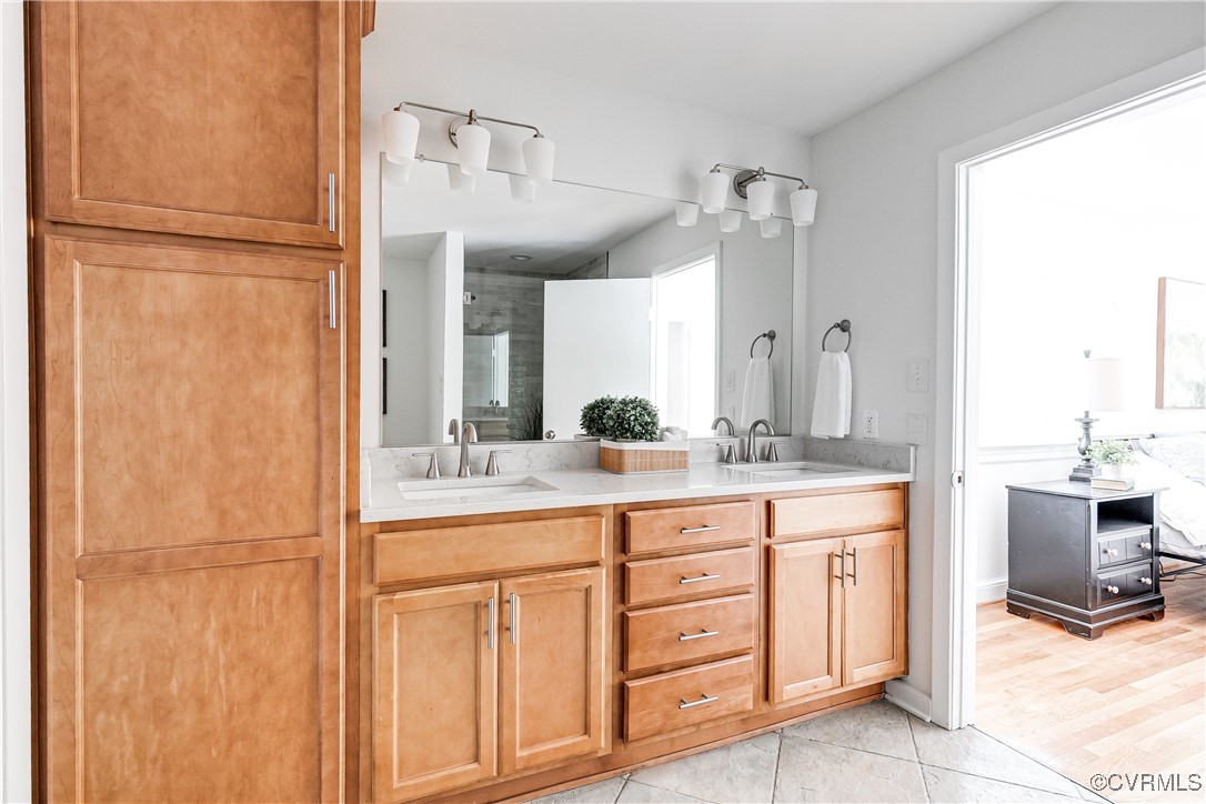 7654 Cherokee Road Richmond, VA 23225 - Photo 23 of 35 a bathroom with a granite countertop sink and a mirror