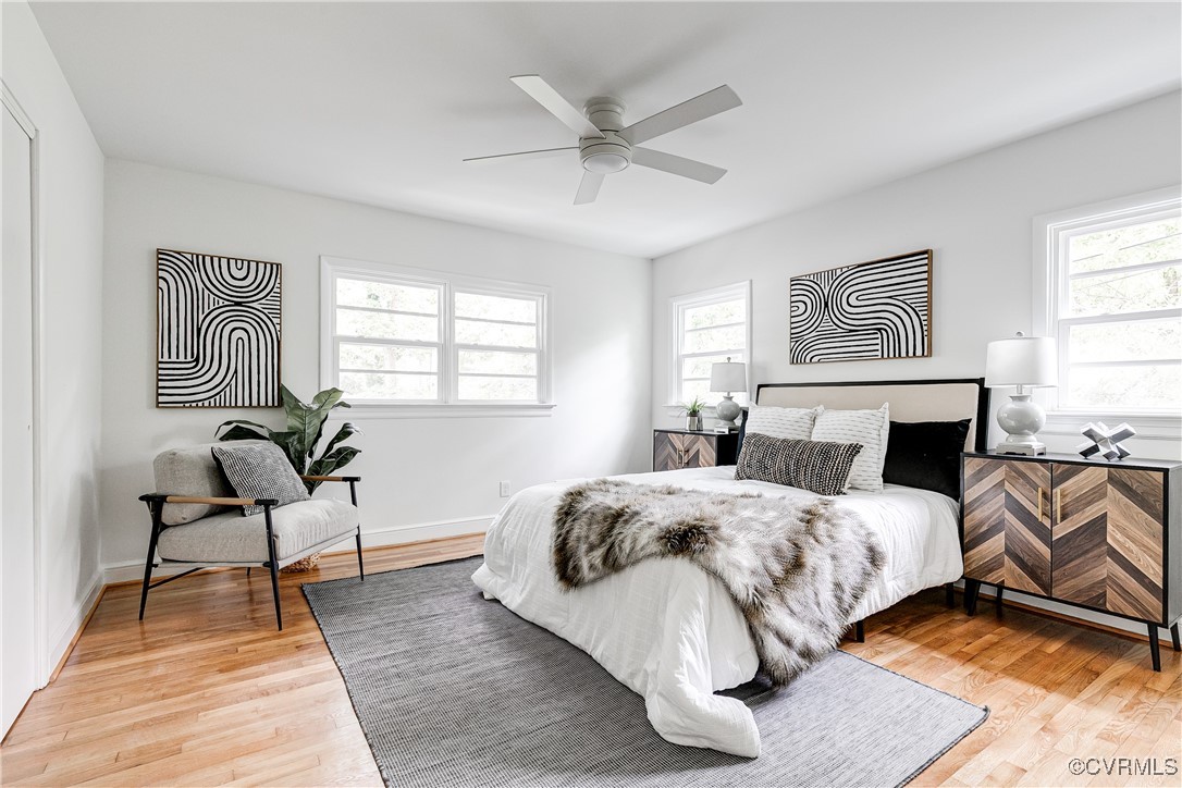 7654 Cherokee Road Richmond, VA 23225 - Photo 31 of 35 a bedroom with a bed and a chandelier