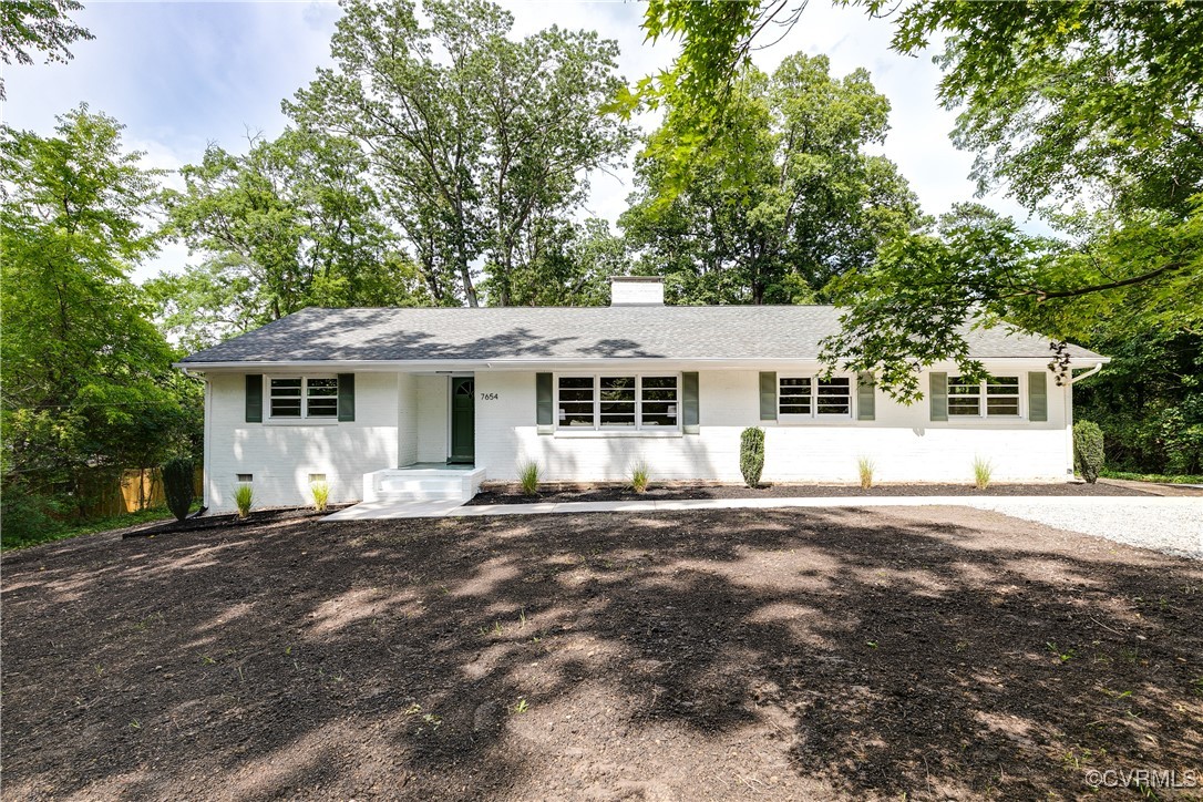 7654 Cherokee Road Richmond, VA 23225 - Photo 35 of 35 a front view of a house with a garden