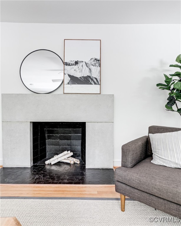 7654 Cherokee Road Richmond, VA 23225 - Photo 6 of 35 a living room with furniture and a fireplace