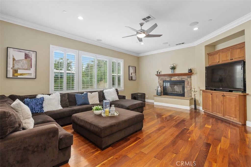 13337 Hunt Club Drive Rancho Cucamonga, CA 91739 - Photo 12 of 45 Family room with ceiling fan and a third fireplace