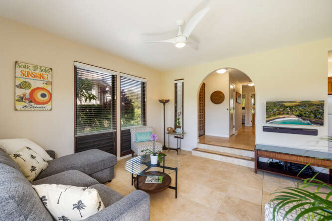 1901 Poipu Road, Unit 311 Koloa, HI 96756 - Photo 11 of 29 a living room with furniture and a floor to ceiling window