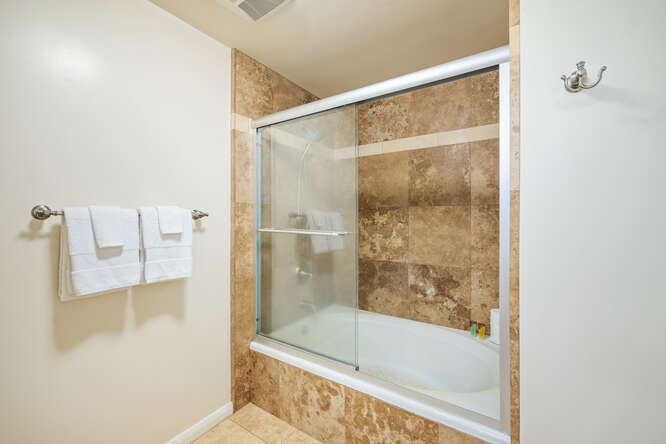 1901 Poipu Road, Unit 311 Koloa, HI 96756 - Photo 15 of 29 a bathroom with a bathtub and a shower