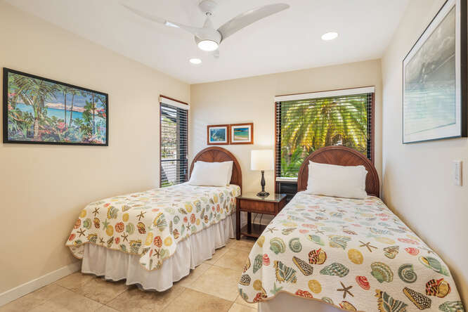 1901 Poipu Road, Unit 311 Koloa, HI 96756 - Photo 16 of 29 a bedroom with double bed and a painting on the wall