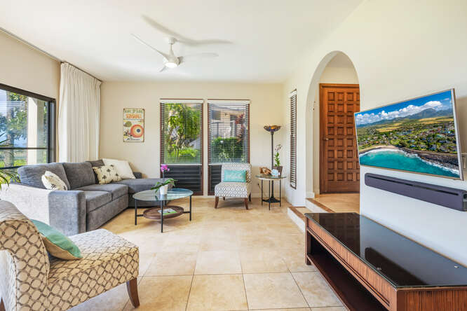 1901 Poipu Road, Unit 311 Koloa, HI 96756 - Photo 2 of 29 a living room with furniture and a flat screen tv