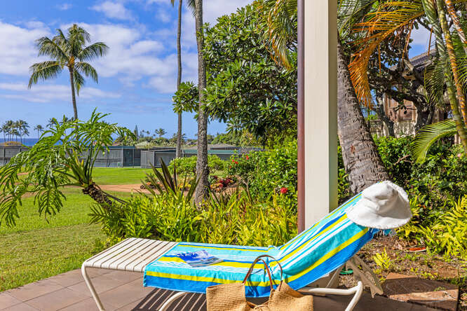 1901 Poipu Road, Unit 311 Koloa, HI 96756 - Photo 22 of 29 a view of a swimming pool with a bench and potted plants