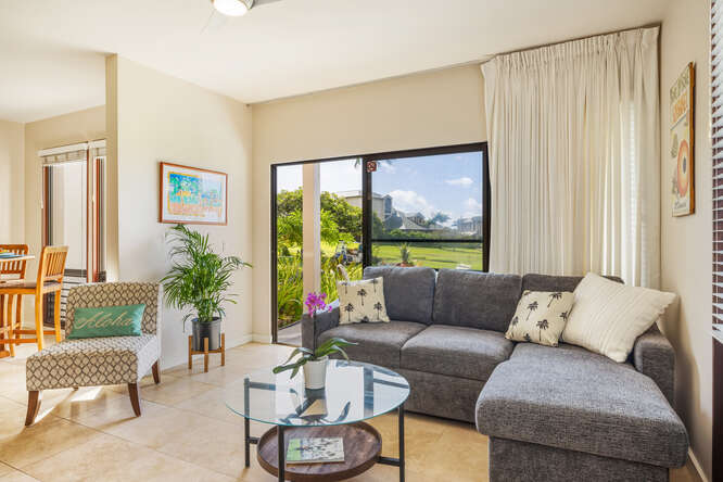 1901 Poipu Road, Unit 311 Koloa, HI 96756 - Photo 23 of 29 a living room with furniture and a large window