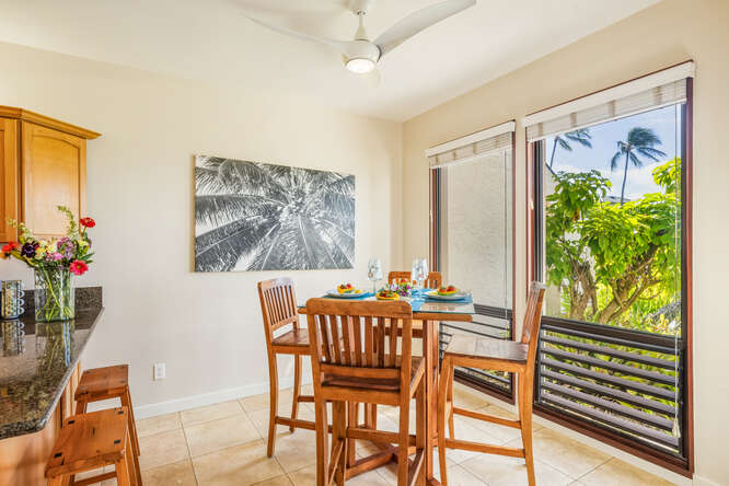 1901 Poipu Road, Unit 311 Koloa, HI 96756 - Photo 25 of 29 a dining room with furniture and a potted plant