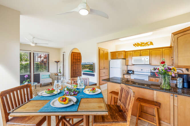 1901 Poipu Road, Unit 311 Koloa, HI 96756 - Photo 4 of 29 a view of a dining room with furniture water and mountain view