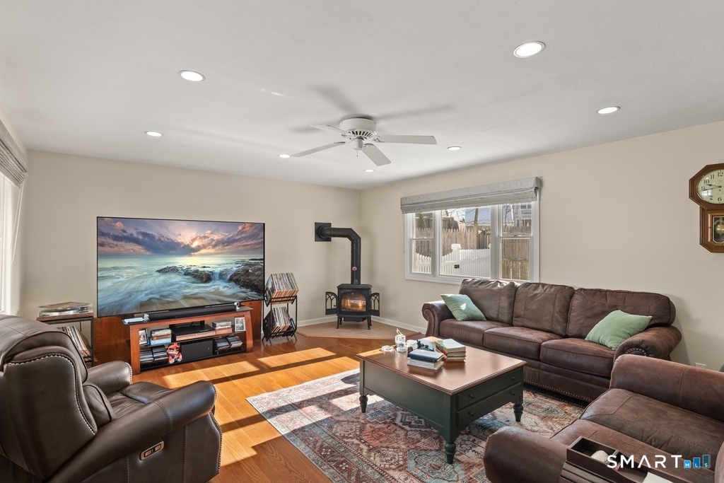 49 Minivale Road Stamford, CT 06907 - Photo 12 of 30 Huge, brilliant Fam Rm features gas stove, engineered wood floors.