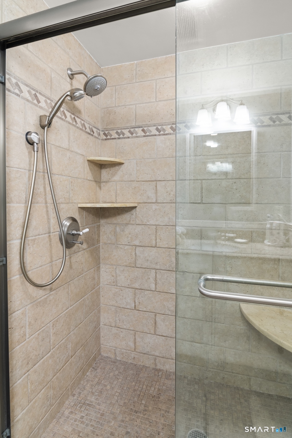 49 Minivale Road Stamford, CT 06907 - Photo 16 of 30 Walk In shower, beautifully tiles, corner bench seat.