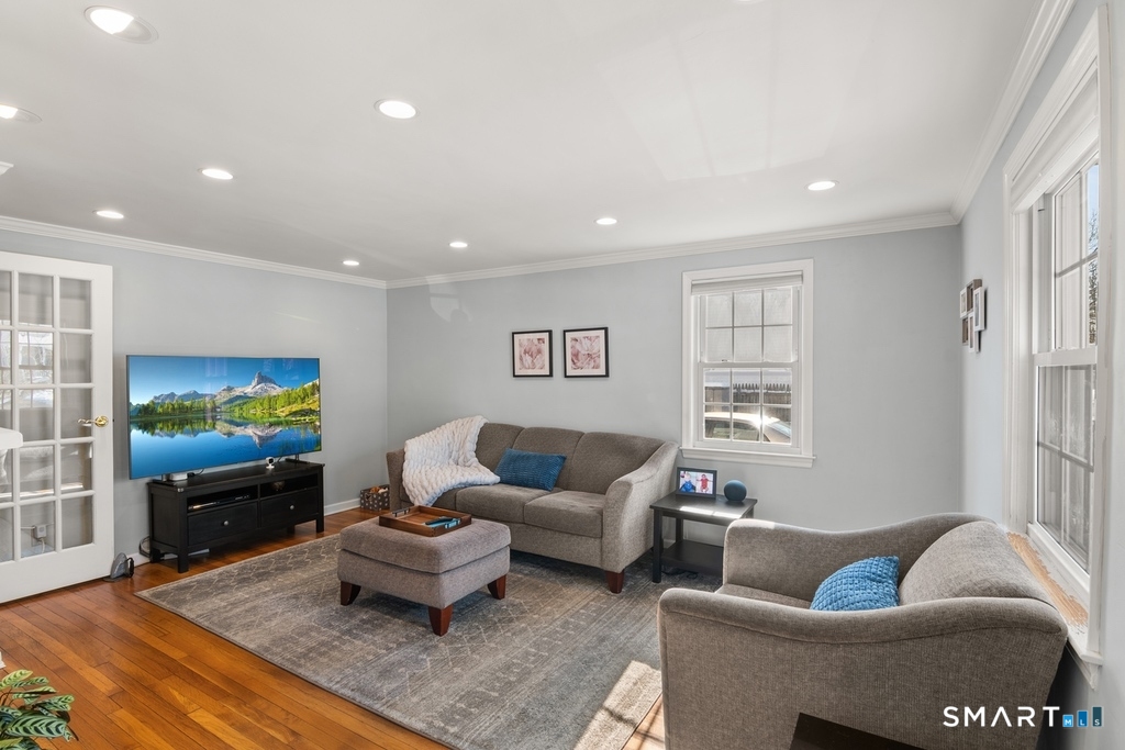 49 Minivale Road Stamford, CT 06907 - Photo 3 of 30 Sun drenched, beautiful hardwood floors and fireplace.