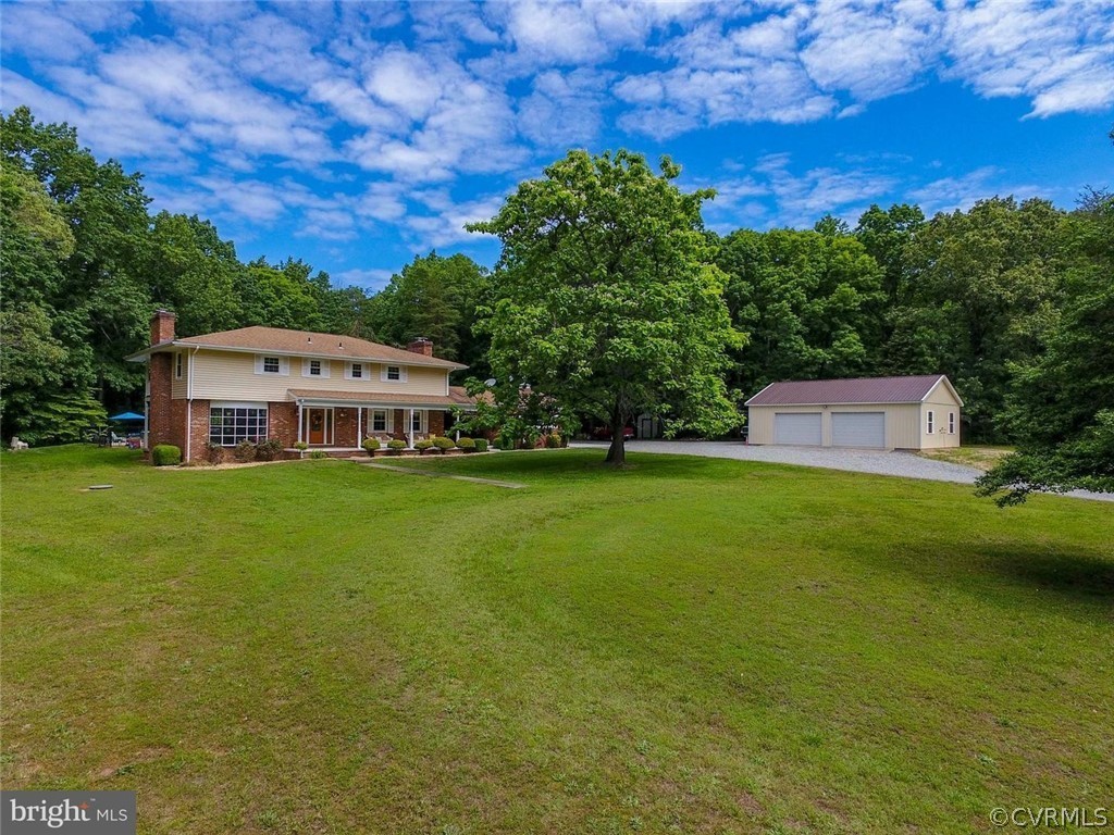 2400 Butler Road Beaverdam, VA 23015 - Photo 2 of 46 a front view of a house with a garden