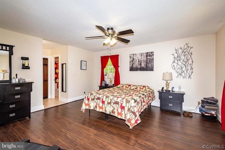 2400 Butler Road Beaverdam, VA 23015 - Photo 24 of 46 a bedroom with a bed and a chandelier