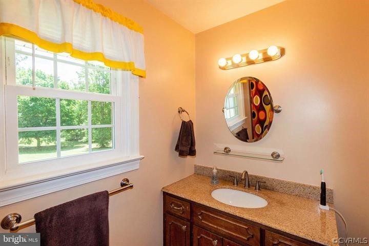 2400 Butler Road Beaverdam, VA 23015 - Photo 29 of 46 a bathroom with a sink and a mirror