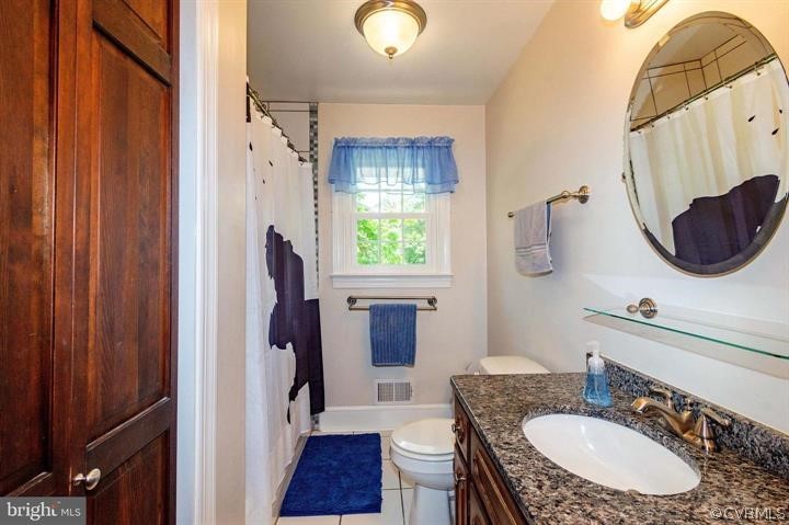 2400 Butler Road Beaverdam, VA 23015 - Photo 36 of 46 a bathroom with a granite countertop sink and a mirror