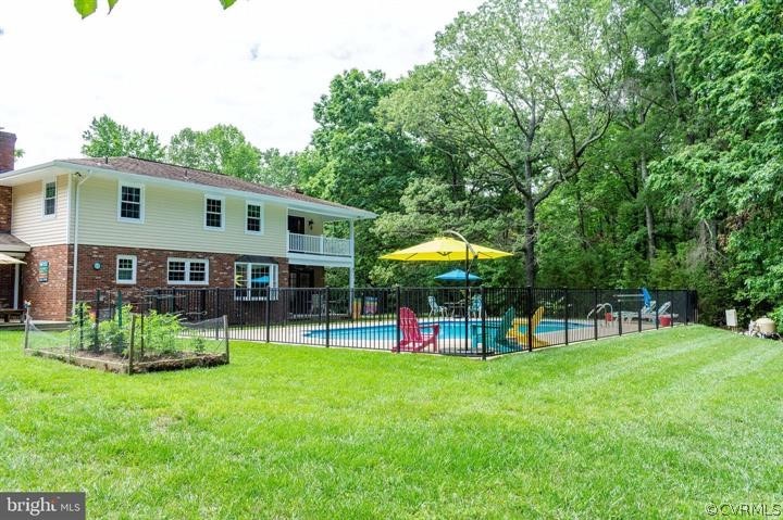 2400 Butler Road Beaverdam, VA 23015 - Photo 44 of 46 a view of a house with a backyard and a table and chairs