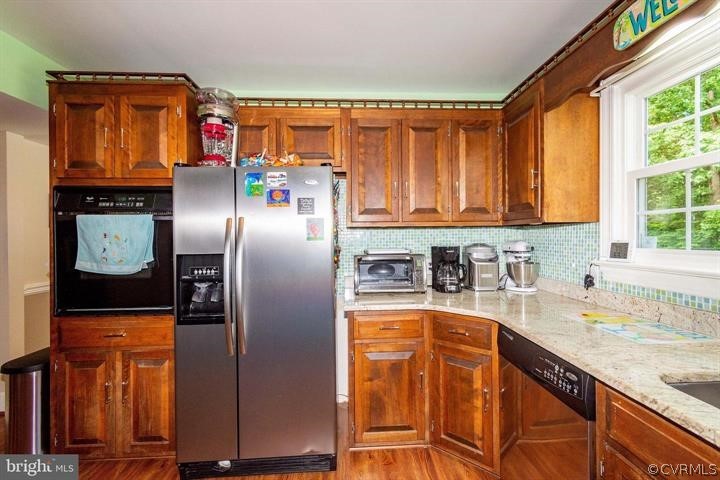 2400 Butler Road Beaverdam, VA 23015 - Photo 7 of 46 a kitchen with stainless steel appliances granite countertop a refrigerator and a sink