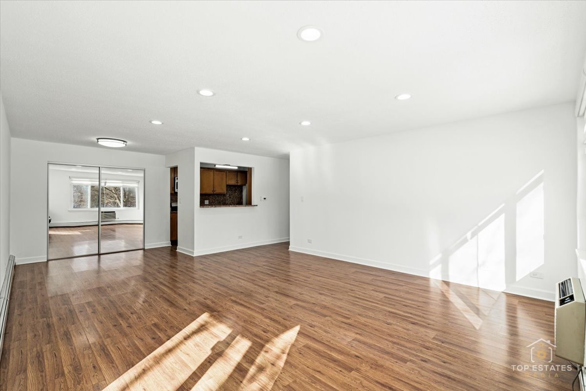 1107 South Old Wilke Road, Unit 208 Rolling Meadows, IL 60005 - Photo 14 of 43 a view of empty room with wooden floor