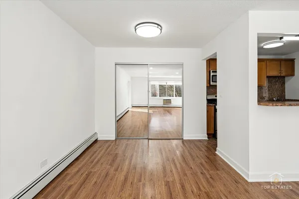 a kitchen with stainless steel appliances granite countertop a sink a stove and refrigerator