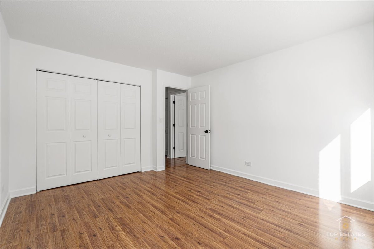 1107 South Old Wilke Road, Unit 208 Rolling Meadows, IL 60005 - Photo 31 of 43 a view of empty room with wooden floor