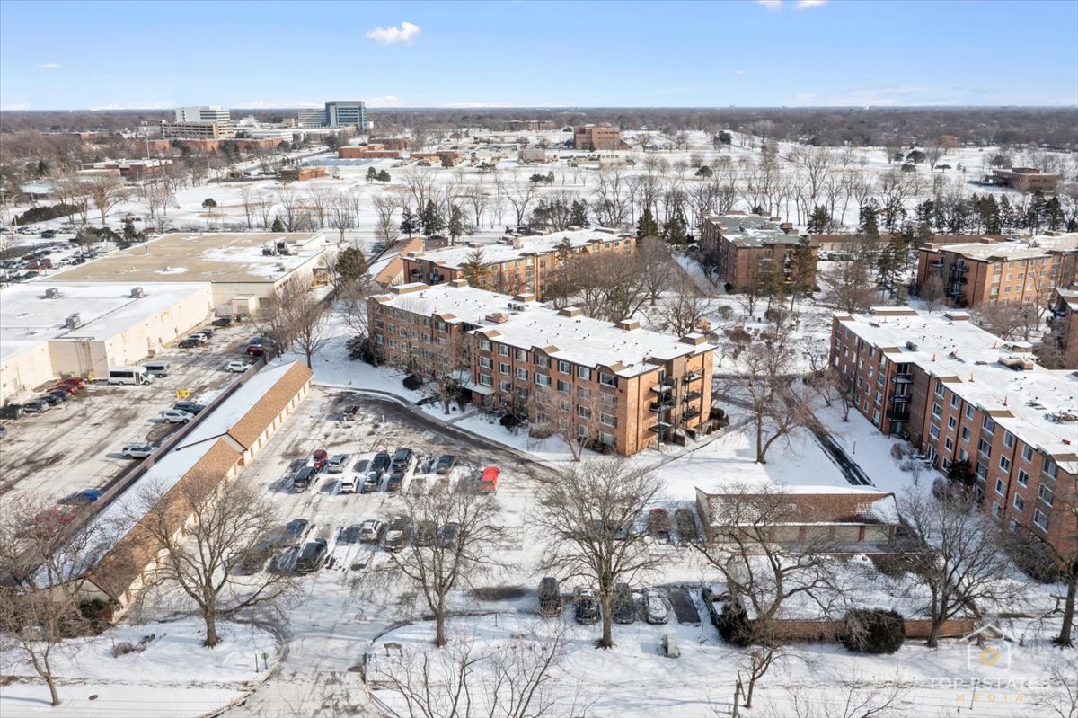 1107 South Old Wilke Road, Unit 208 Rolling Meadows, IL 60005 - Photo 6 of 43 a city view with tall buildings