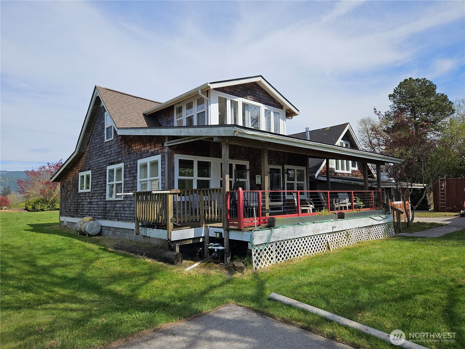 20 East Sunny Sands Road Cathlamet, WA 98612 - Photo 16 of 19 a view of a house with a yard porch and sitting area