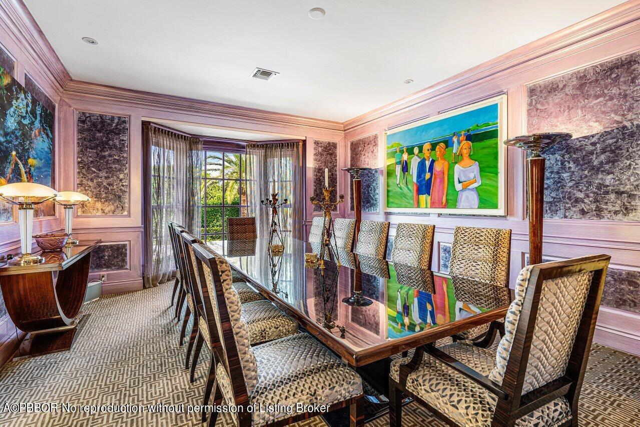 168 Kings Road Palm Beach, FL 33480 - Photo 12 of 30 a view of a dining room with furniture a chandelier and wooden floor